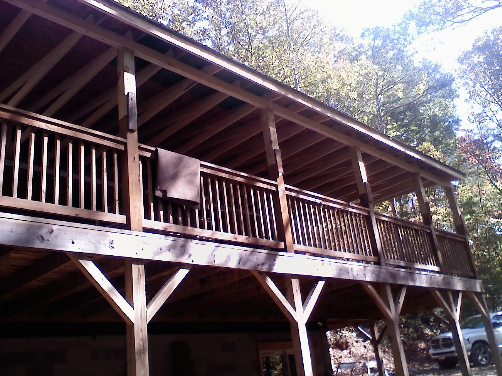 Timber framing under a new elevated porch and deck — Roof Leak Repair in North Pitcher by Roofing Brothers